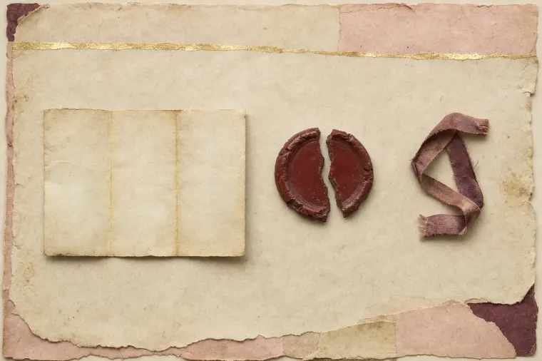 A single blank leaf of heavy laid paper with a broken red wax seal and a length of ribbon lying loose beside it, the leaf carrying no writing at all.
